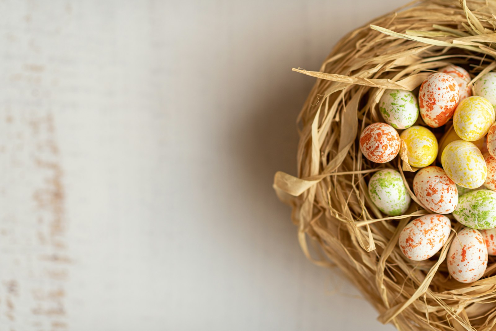 Photo by Anastasiia Chepinska a bird nest filled with eggs on top of a table